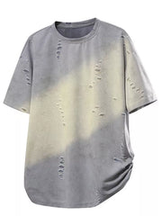 Oversized distressed grey t-shirt with tie-dye effect and raw hem.