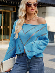 Blue open-stitch chevron boat neck knit sweater with relaxed fit and airy details.
