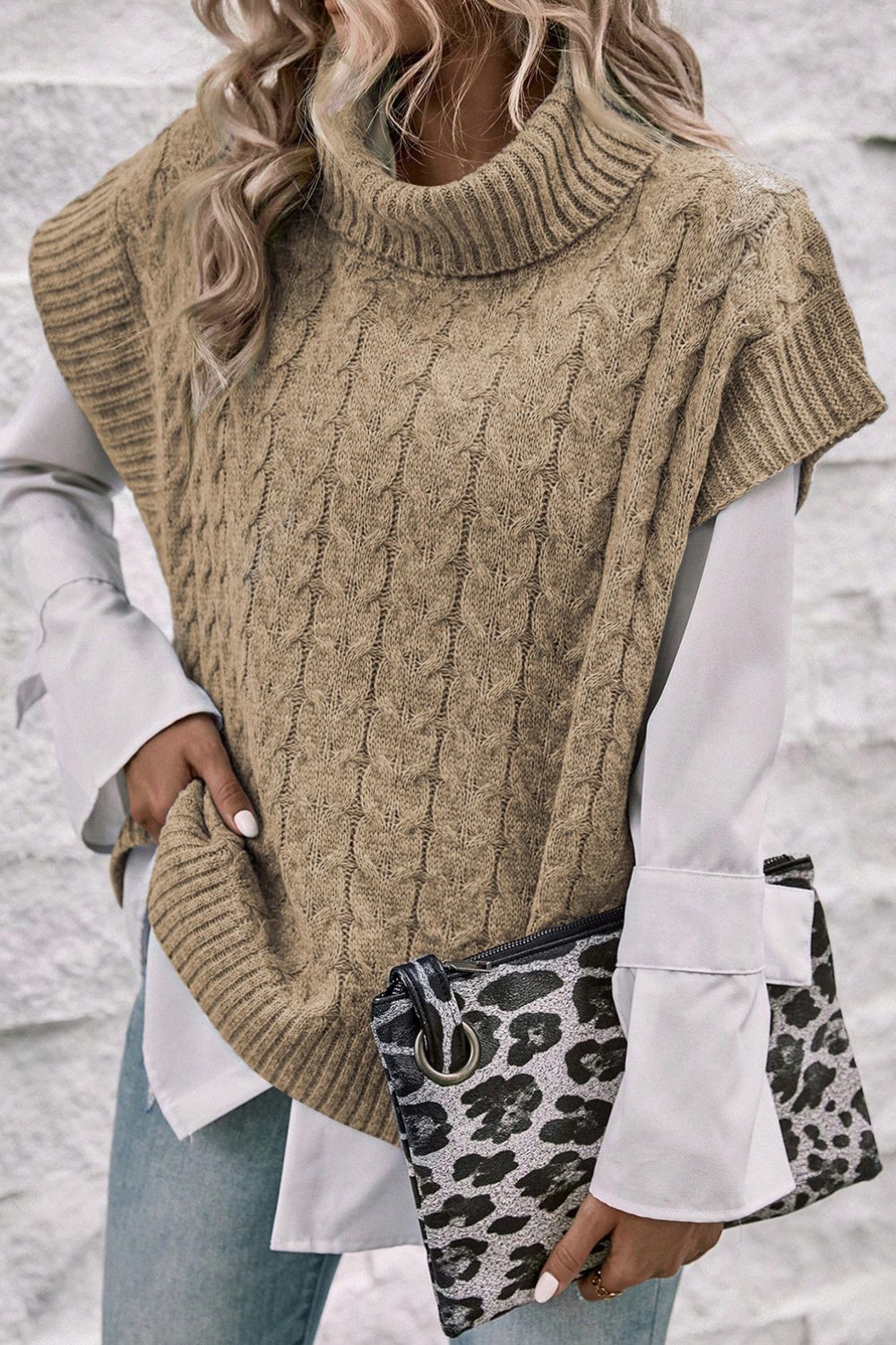 Khaki cable knit turtleneck capelet sweater with ribbed trim.