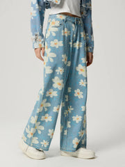 Daisy Field Wide Leg Denim jeans in light wash with a floral print and button fly.