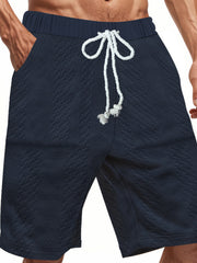 Navy blue quilted texture drawstring men's chino shorts with diamond pattern.