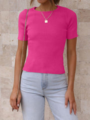 Fuchsia pink ribbed knit t-shirt with short puff sleeves and a crew neck.