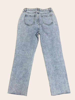 Light wash denim wide leg jeans with distressed knee rips and button fly.