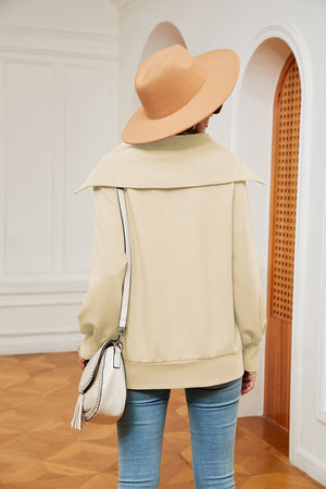 Cream wide collar zip-through sweatshirt with a relaxed fit.