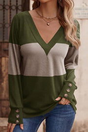 Colorblock V-neck knit top with button cuffs in green and taupe.