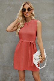 Coral belted knit tank dress with A-line cut and crew neck.
