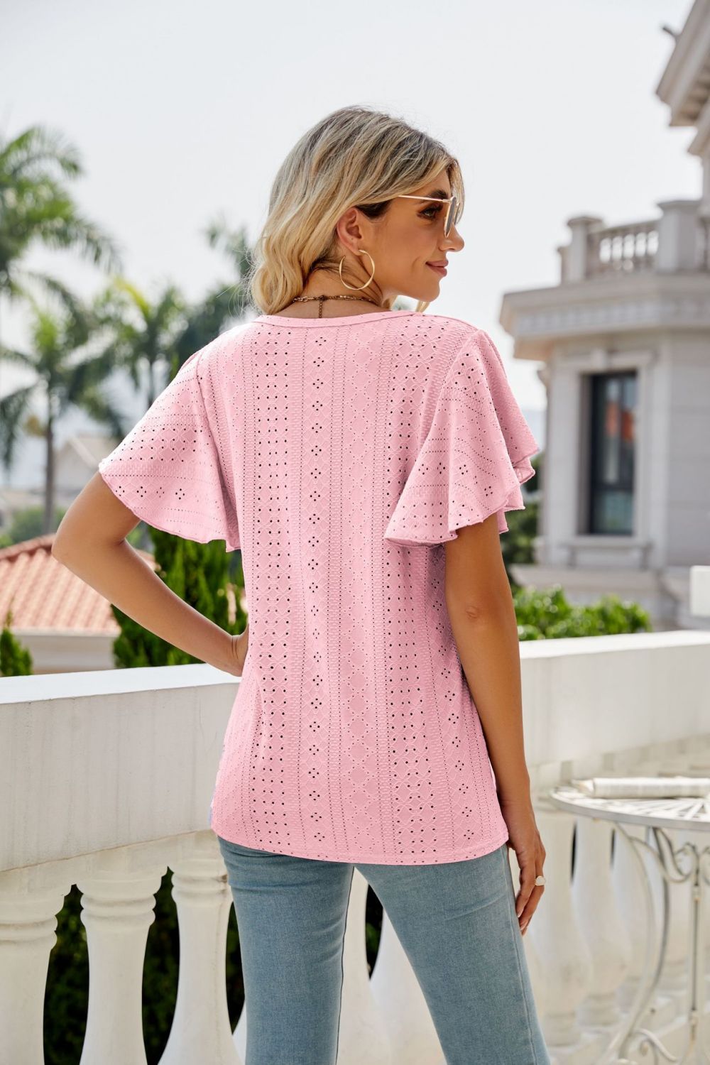 Blush pink eyelet crew neck top with flounce sleeves