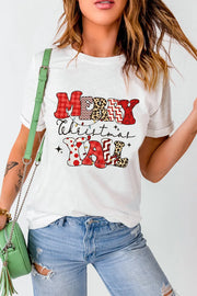 White t-shirt with festive patchwork "Merry Christmas Y'all" graphic and string lights.