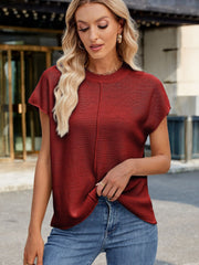 Burgundy knit cap sleeve top with vertical seam detail and mock neckline.