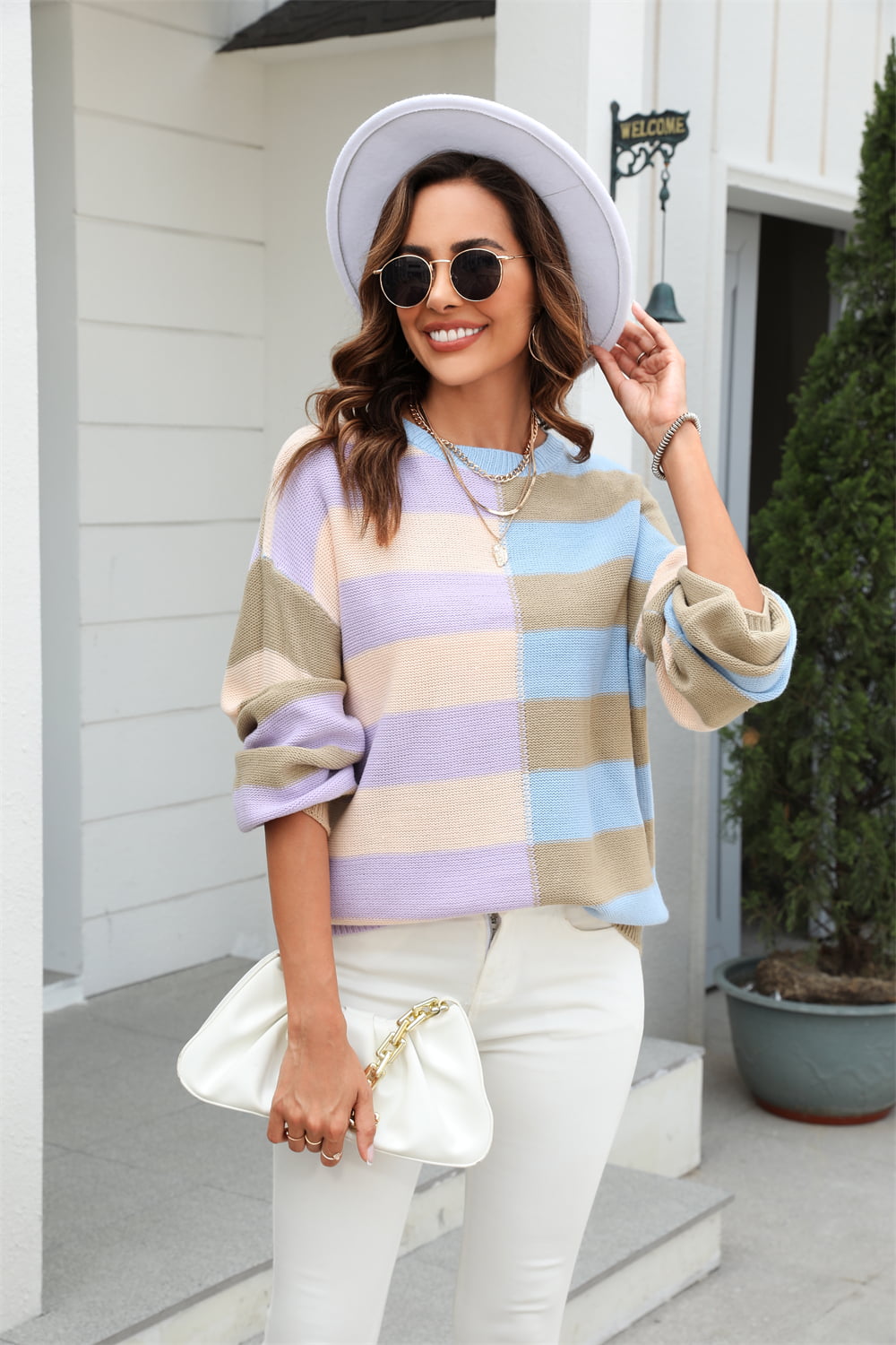Pastel block stripe crewneck pullover sweater in acrylic with a crew neck and long sleeves.