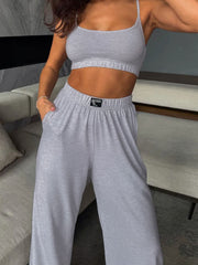 Light gray scoop neck cami and wide-leg pants set with elastic waistband and pockets.