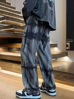 Men's black distressed vintage wash wide-leg jeans with tie-dye effect