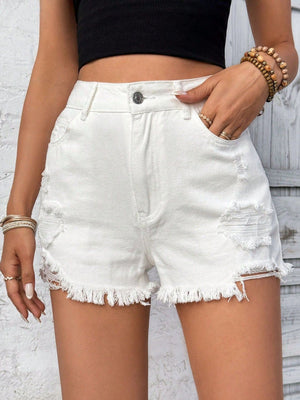 White denim distressed shorts with frayed hem and ripped details.