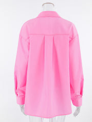 Pink cotton relaxed fit shirt with pleats on the back and button cuffs.