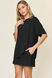 Black waffle knit boxy tee and shorts set with pockets.