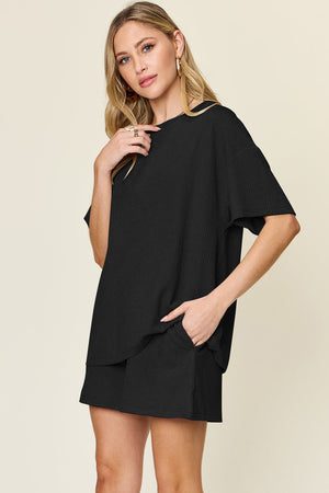 Black waffle knit boxy tee and shorts set with pockets.
