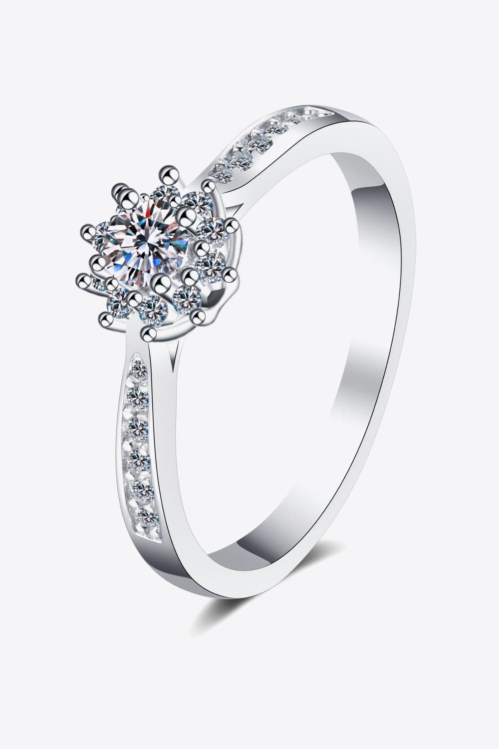 Silver moissanite ring with a celestial cluster design and pave band.