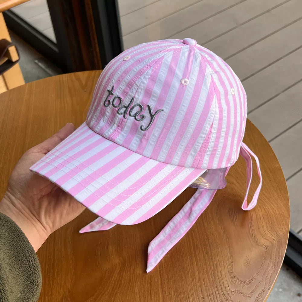 Pink and white striped cotton baseball cap with "today" embroidery and bow detail.