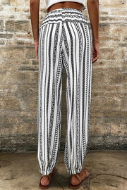 Embroidered stripe drawstring joggers with elastic cuffs and a smocked waistband.