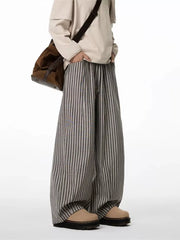 Striped wide-leg sweatpants in gray with a drawstring waist and relaxed fit.