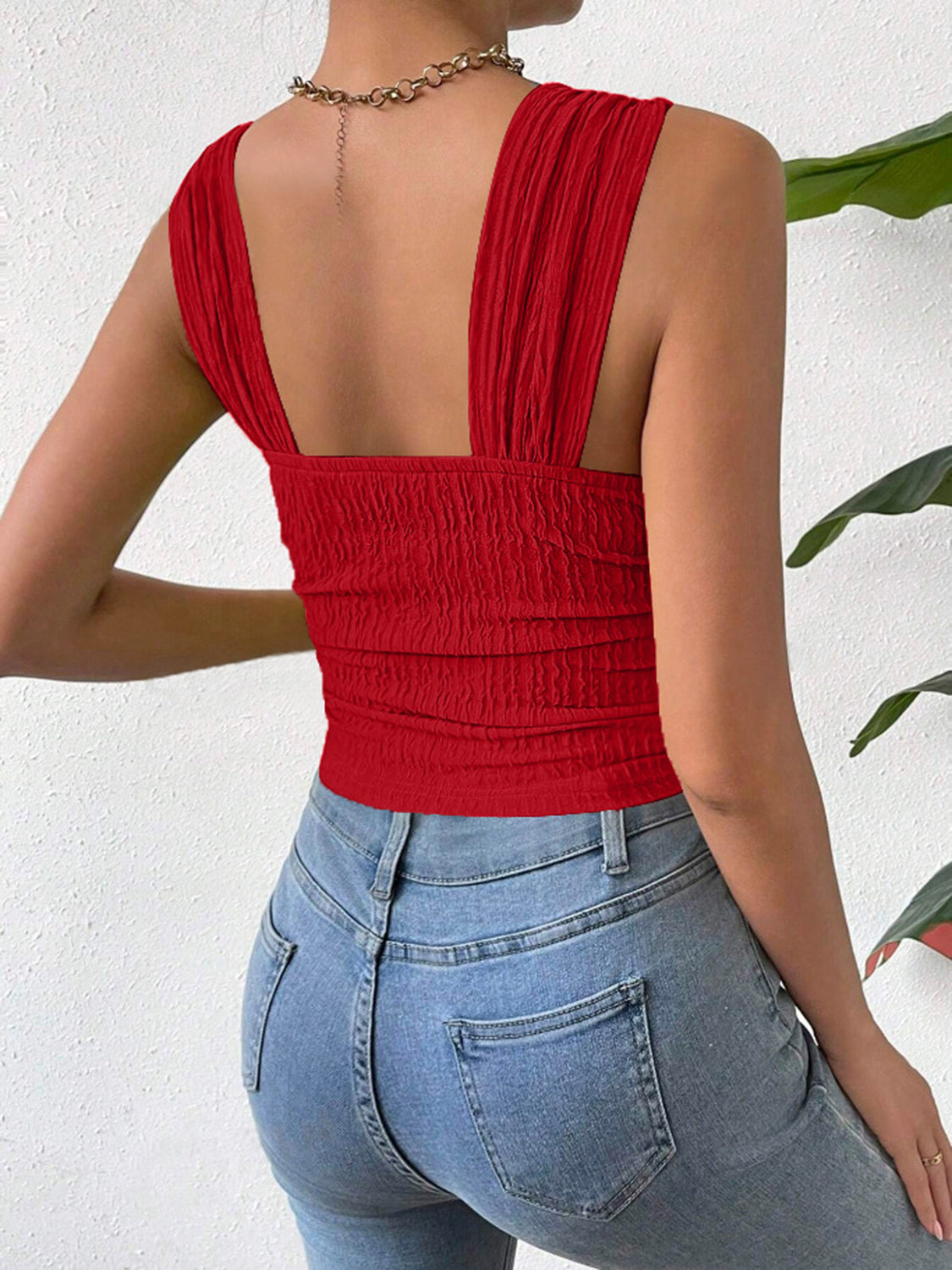 Red crinkle strap crop top with ruched detailing and square neckline.