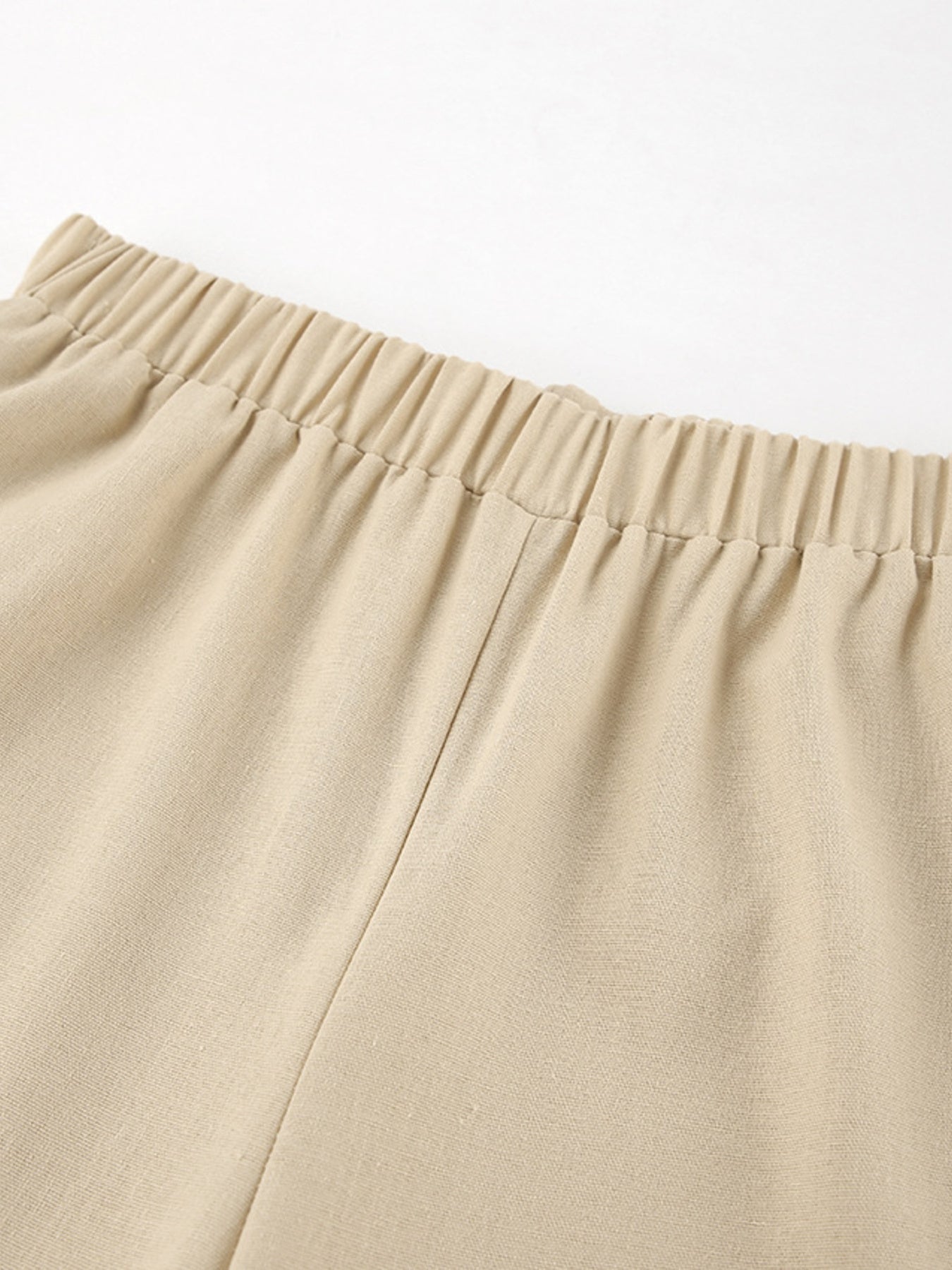 Tan cotton wide-leg pants with elastic waistband detail