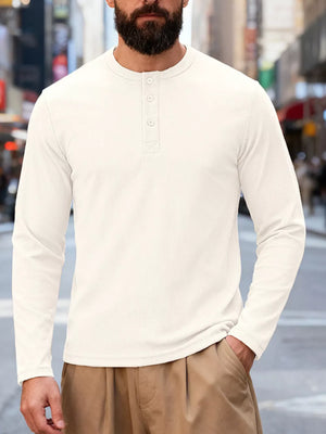 Men's white cotton long sleeve henley t-shirt with button placket and relaxed fit.