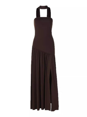 Brown asymmetrical maxi dress with halter neck, ruffle detail, and thigh-high slit.
