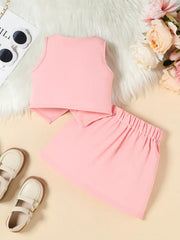 Pink baby outfit with sleeveless top and pleated skirt.