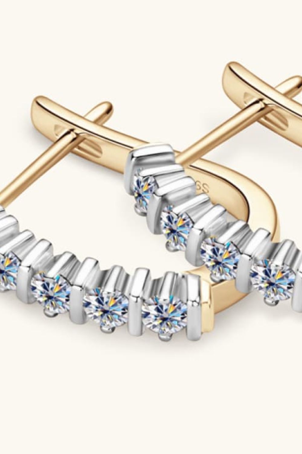 Silver pavé hoop earrings with moissanite and gold plating.