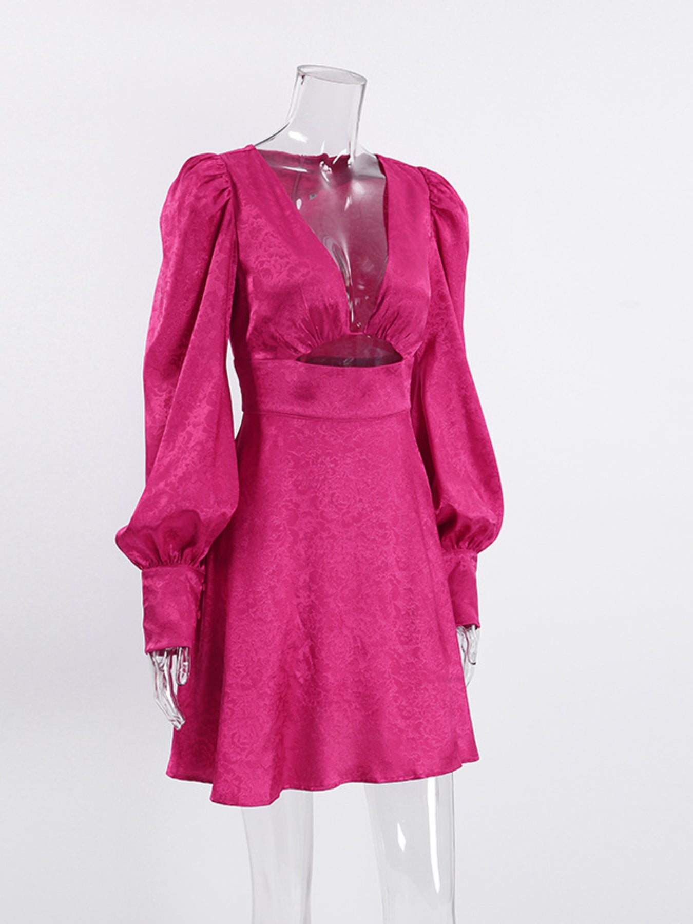 Vibrant mini dress with deep V-neck, cutout detail, and lantern sleeves in cerise.