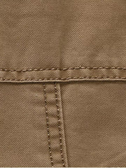 Khaki cotton blazer detail showing stitching and fabric texture.