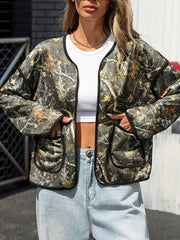 Camouflage print open jacket with black trim and pockets, made of polyester.