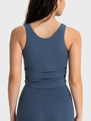 Sculpted ruched tank top in peacock blue with a scoop neck and athletic fit.