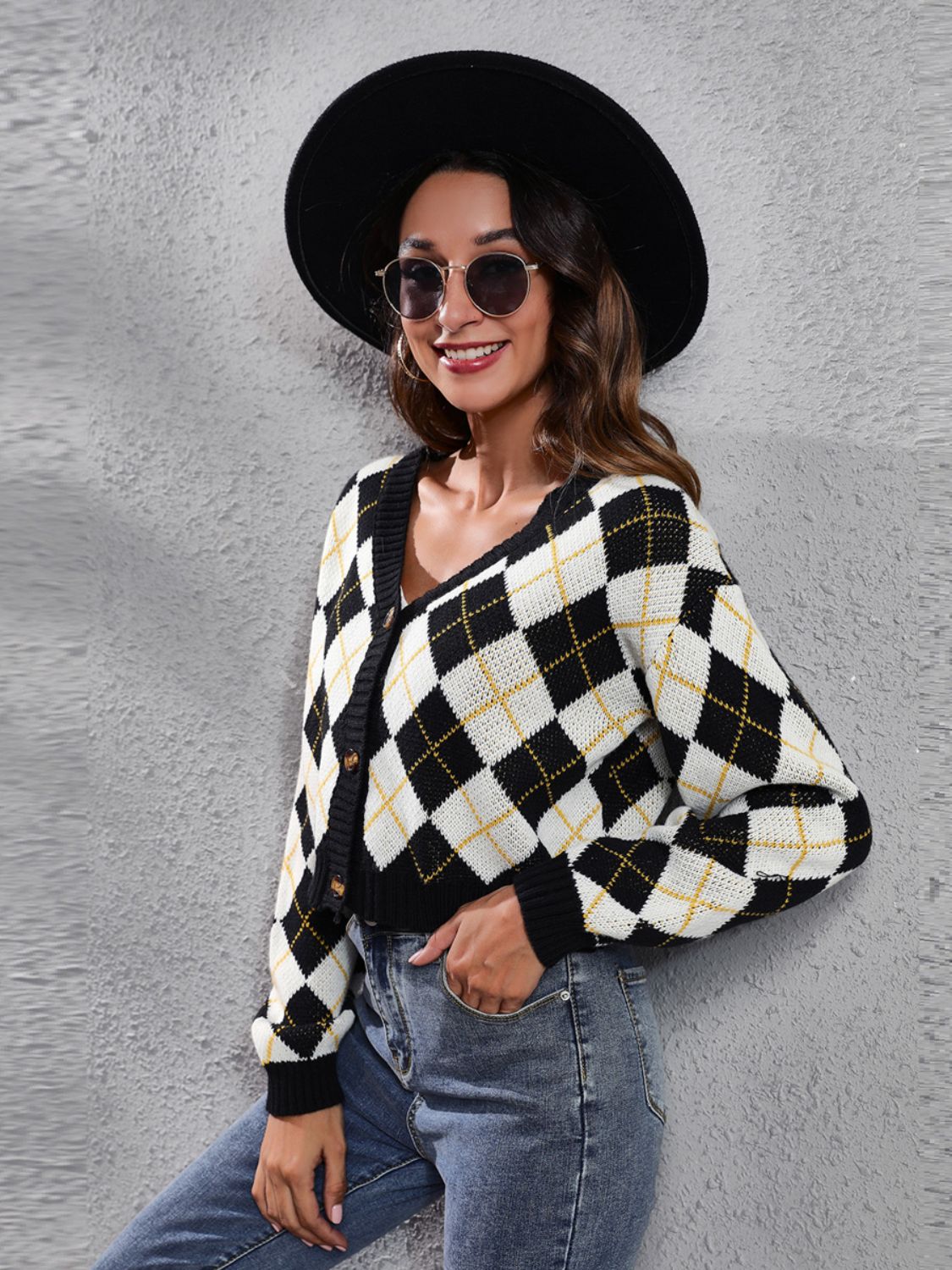 Argyle cropped cardigan in ivory, black, and yellow with button front and V-neck.