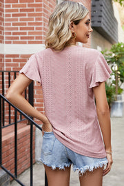 Flutter sleeve eyelet top in watermelon pink with a textured pattern.