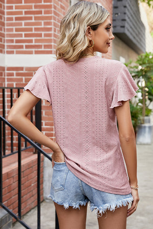 Flutter sleeve eyelet top in watermelon pink with a textured pattern.