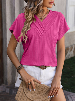 Hot Pink textured tee with surplice V-neck and short sleeves.