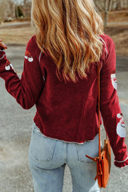 Sequin Santa waffle knit top in scarlet with long sleeves and festive sequin details on the cuffs.