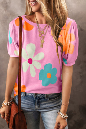 Pink floral puff sleeve t-shirt with round neck and short sleeves.
