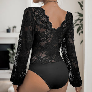 Black lace bodysuit with scalloped plunge neckline and long sleeves.