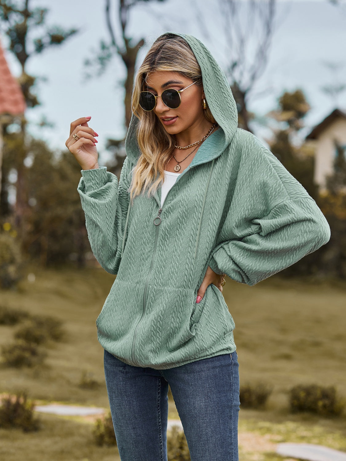 Sage green textured knit dolman sleeve zip-up hoodie with pockets