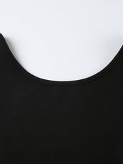 Black long-sleeve active romper with a boat neck and body-contouring fit.