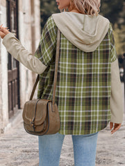 Colorblock plaid hooded shirt jacket in matcha green with contrast sleeves and tan hood.