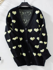 Black acrylic knit cardigan with allover light yellow hearts and button front.