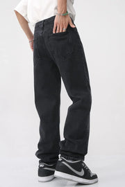 Faded wash baggy jeans in dark denim with a relaxed fit.