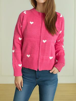 Hot Pink zip-through knit cardigan with white heart pattern, crew neck, long sleeves.