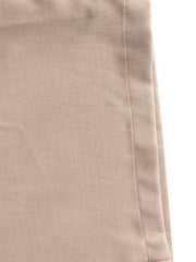 Halter neck wide leg jumpsuit in beige fabric with visible stitching detail.