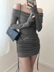 Grey ruched bodycon mini dress with off-the-shoulder neckline and drawstring detail.