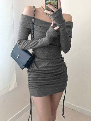 Grey ruched bodycon mini dress with off-the-shoulder neckline and drawstring detail.